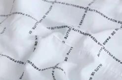 White Letter Print Long Shirt | Hyunjin - Stray Kids -Diva s Closet Hyunjin Stray Kids White Letter Print Long Shirt 5 600x397 1