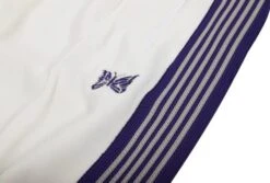 White Butterfly Striped Track Pants | Jungkook - BTS -Diva s Closet Jungkook BTS White Butterfly Striped Track Pants 9 600x405 1